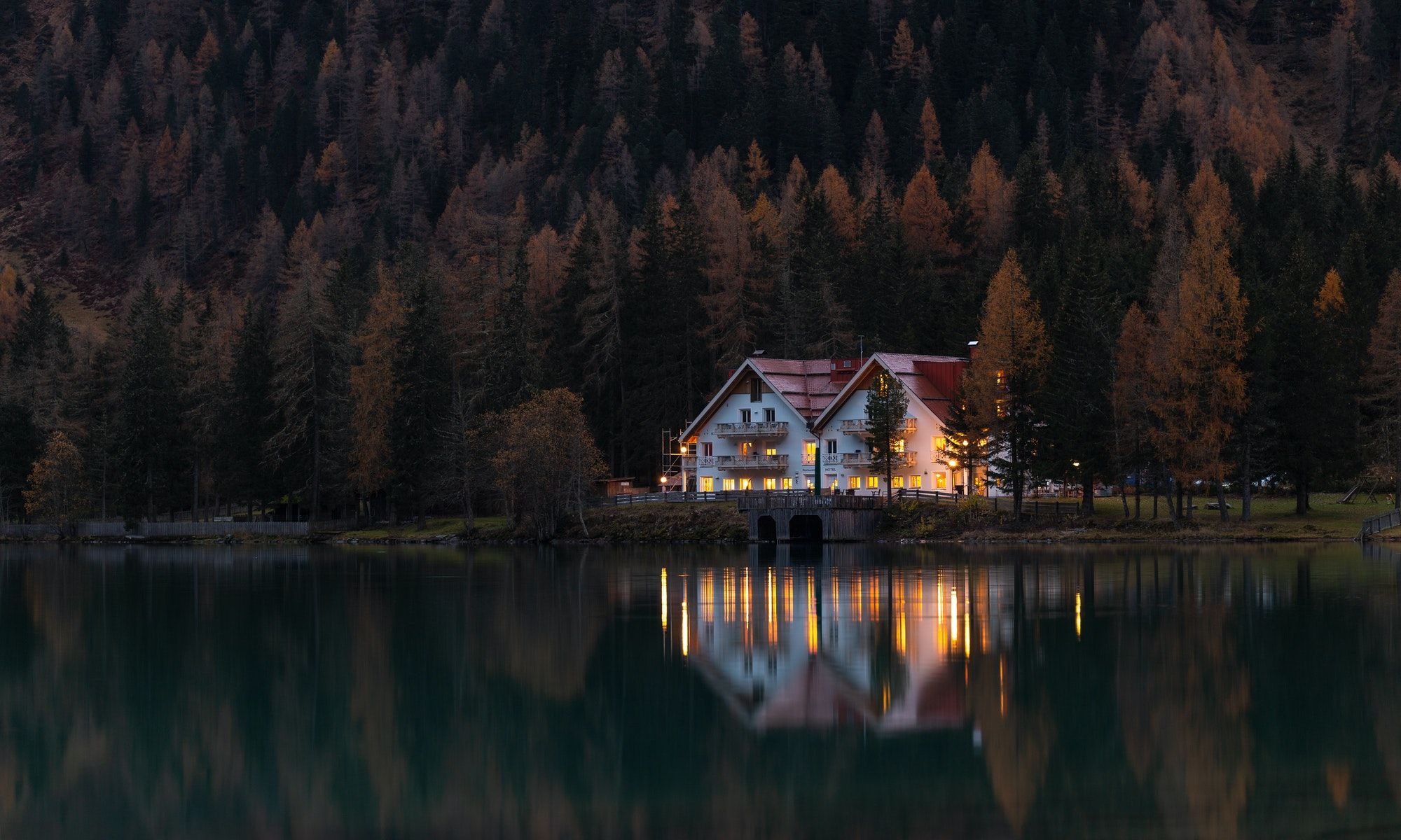 house reflecting on a body of water