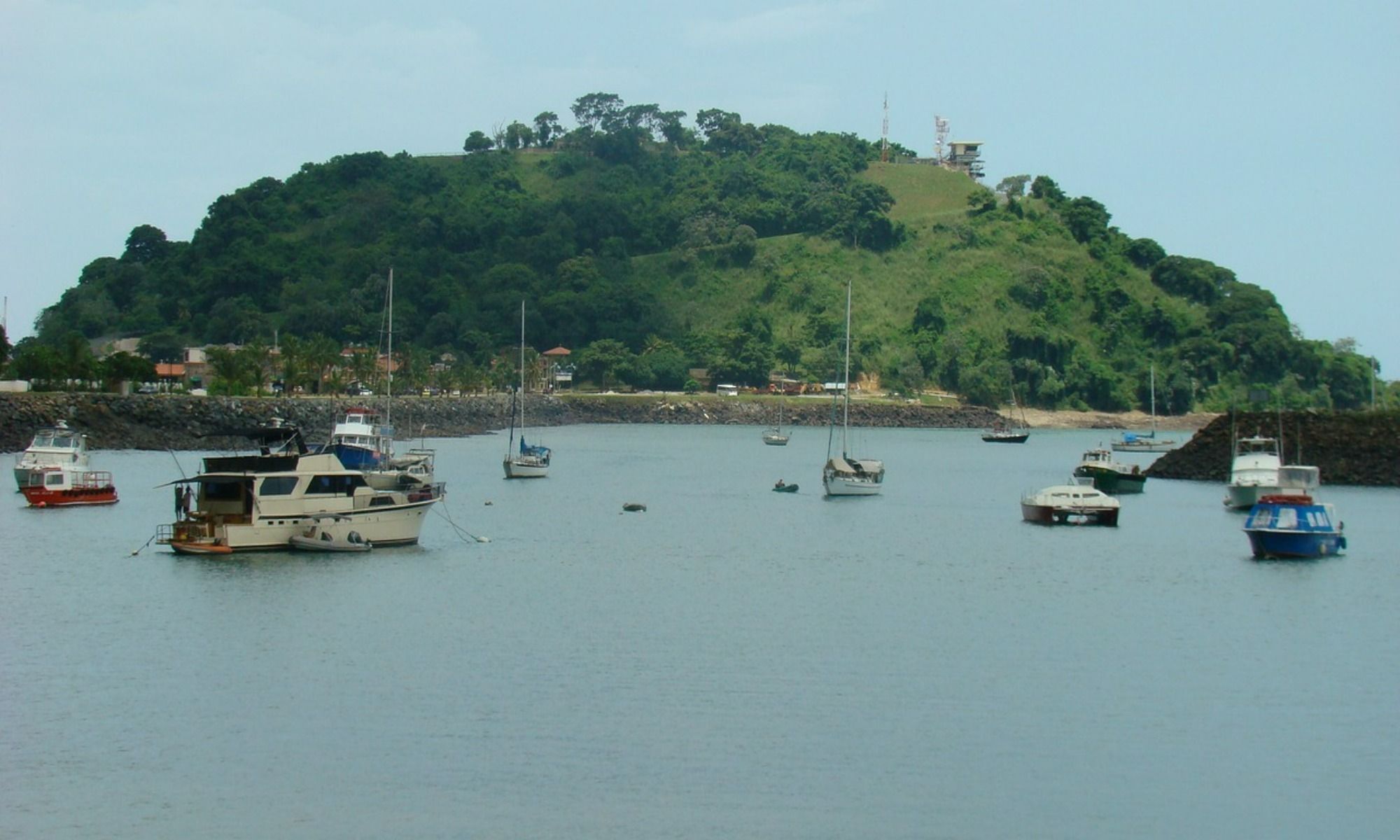 fishing boats facing the view of a mountain