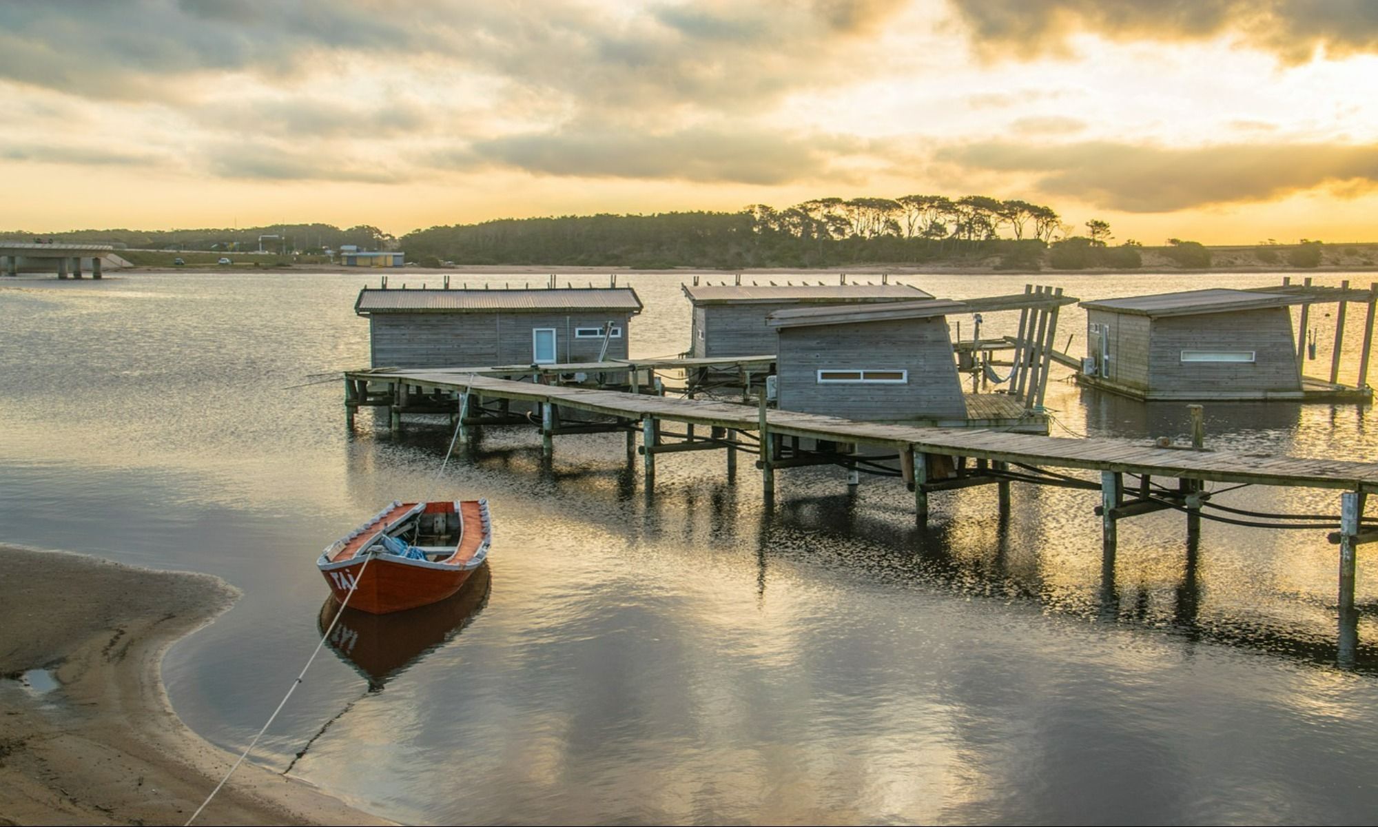 fishing boat on lake near village